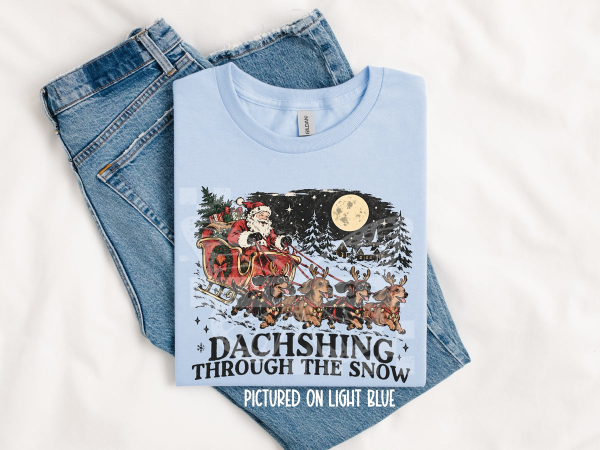 Dachshing Through the Snow Graphic Tee mockup